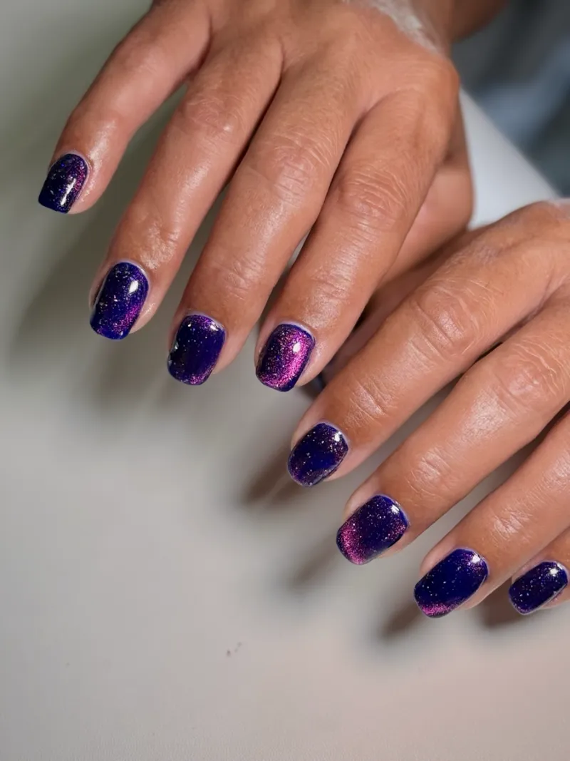 Deep purple cat-eye gel manicure by Nail Oasis in St. George, Utah